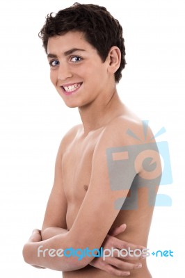 Boy Giving Strange Expression And Smiling Stock Photo