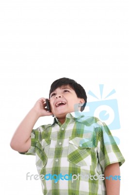 Boy Laughs And Talks With Mobile Stock Photo