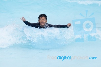 Boy Play In Clear Water Stock Photo
