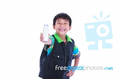 Boy Smiling And Showing Bottle Of Milk, On White Stock Photo