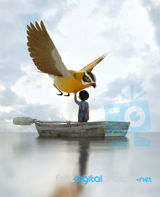 Boy Standing On An Old Wooden Rowboat In The Sea And Touching A Big Bird Stock Image