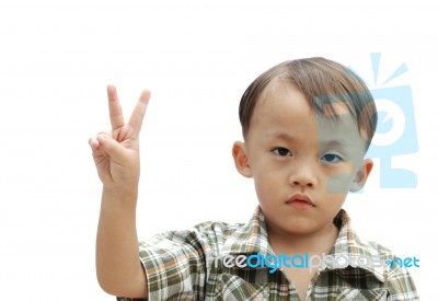Boy With Victory Hand Sign Stock Photo