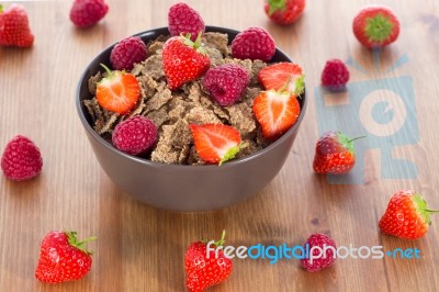 Bran Flakes With Fresh Raspberries And Strawberries Stock Photo