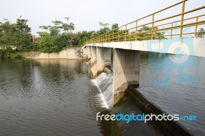 Bridge Over Small Dam Cross River Stock Photo