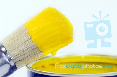 Brush Covered With Yellow Paint Stock Photo