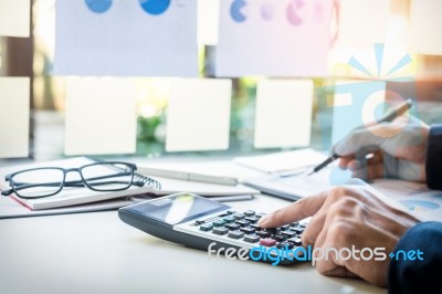 Business Finance Man Calculating Budget Numbers, Invoices And Fi… Stock Photo