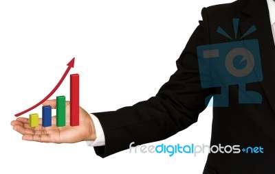 Business Hand With Growing Graph Stock Photo