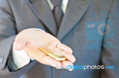 Business Man Holding Gold Stock Photo