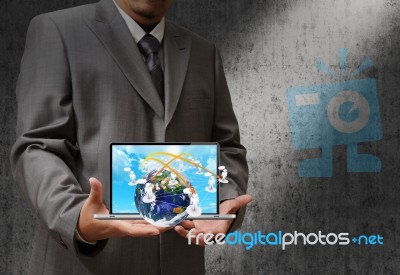Business Man Holding Laptop Stock Photo