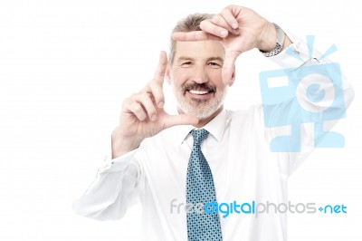 Business Man Making Frame With His Hands Stock Photo
