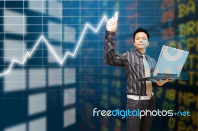 Business Man Point To Graph Report Stock Photo