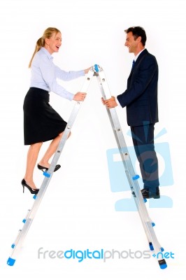 Business People Climbing On Ladder Stock Photo