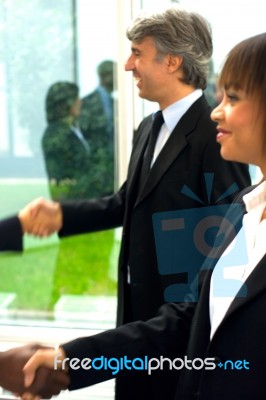 Business People Shaking Hands Stock Photo