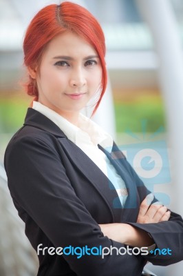 Business Woman Smiling Arms Crossed Stock Photo
