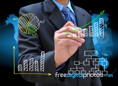 Businessman Hand Drawing Graph Stock Photo
