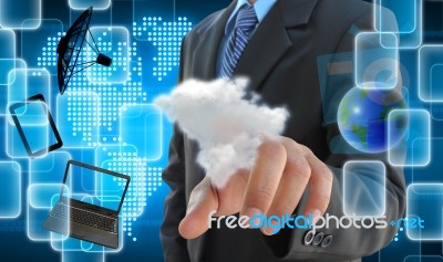 Businessman Hand Pushing A Cloud On A Touch Screen Interface Stock Photo