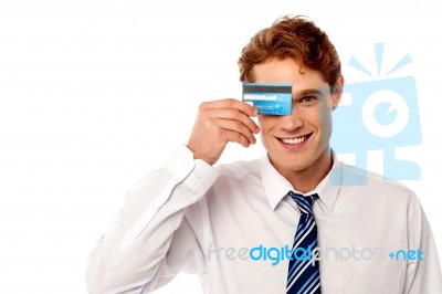 Businessman Hiding His Eye With Credit Card Stock Photo