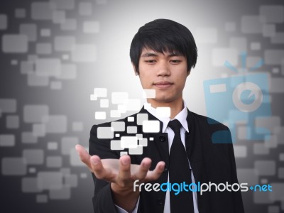 Businessman Holding Virtual Button Stock Photo
