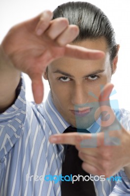 Businessman Making Frame With Hand Gesture Stock Photo
