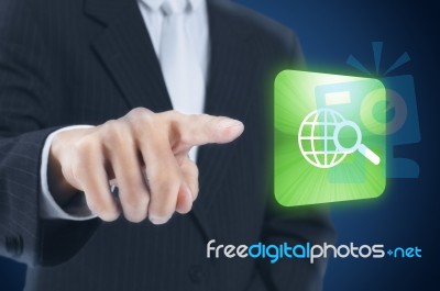 Businessman Pressing Internet Icon Stock Photo