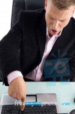 Businessman Pressing Laptop Key Stock Photo