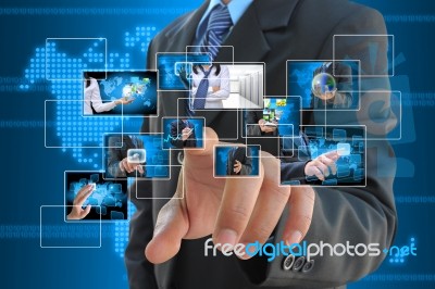 Businessman pressing touch button Stock Photo