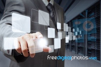 Businessman Pushing Buttons Stock Photo