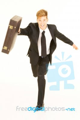 Businessman running with Briefcase Stock Photo