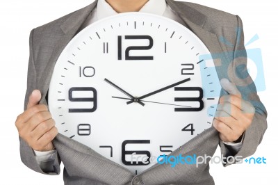 Businessman Showing Clock In Suit Stock Photo