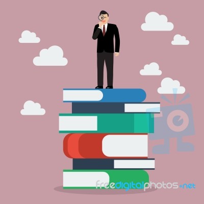 Businessman Standing On Stack Of Books With A Magnifying Glass Stock Image