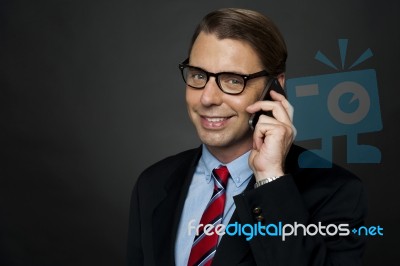 Businessman Talking Over Phone Stock Photo
