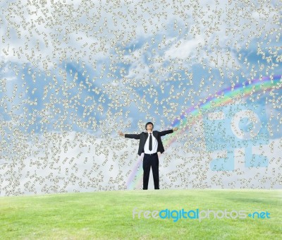 Businessman Under Money Rain Stock Photo