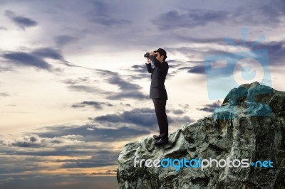 Businessman Using Binoculars Stock Photo