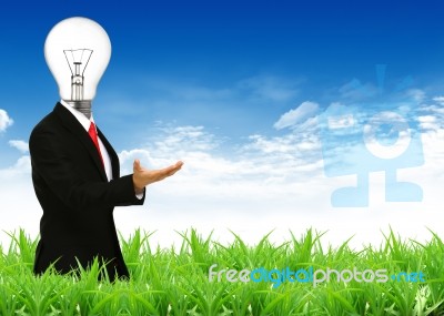 Businessman With Lamp Head Stock Photo