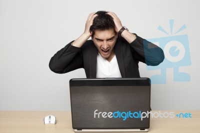 Businessman With Laptop Stock Photo