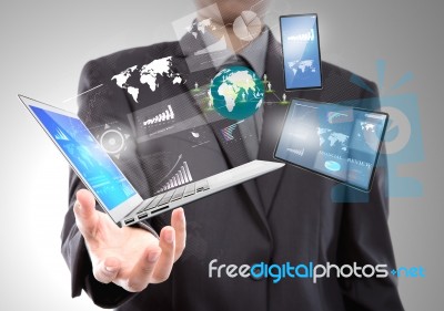 Businessman With Laptop,mobile Phone,touch Screen Device Stock Photo