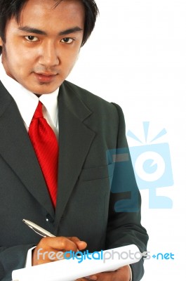 Businessman Writing A Note Stock Photo