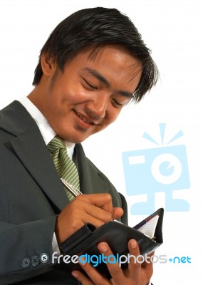 Businessman Writing His Schedule Stock Photo