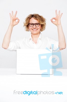 Businesswoman Showing Ok Gesture Stock Photo