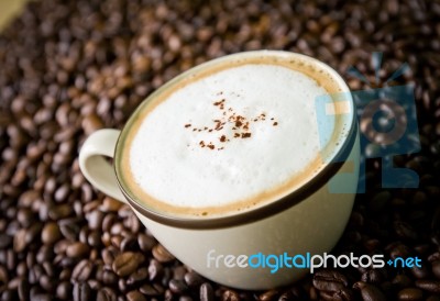 Cappuccino And Coffee Bean Stock Photo