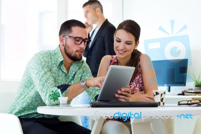 Casual Executives Working Together At A Meeting With Digital Tab… Stock Photo