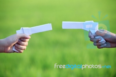Challenging With  Paper Gun Stock Photo