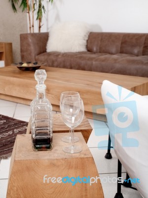 Champagne Glasses With Modern Couch In Background Stock Photo