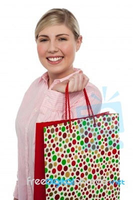 Cheerful Blonde Girl Holding Shopping Bag Stock Photo
