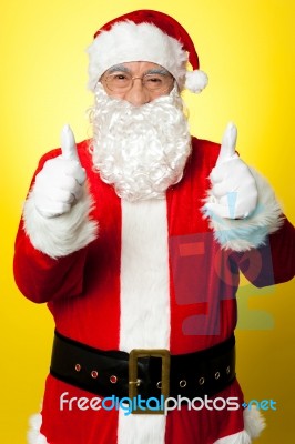 Cheerful Male In Santa Costume Showing Double Thumbs Up Stock Photo