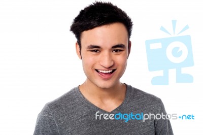 Cheerful Portrait Of An Asian Guy Stock Photo