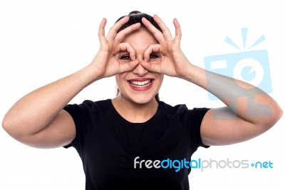 Cheerful Woman In Observe Gesture Stock Photo