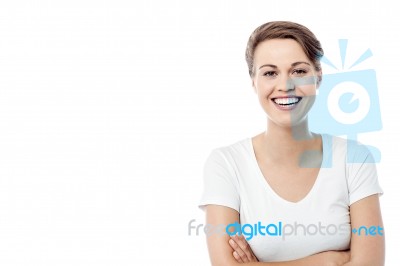 Cheerful Woman Posing With Folded Arms Stock Photo