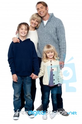 Cheerfully Winter Wear Family Of Four. Stay Protected Stock Photo