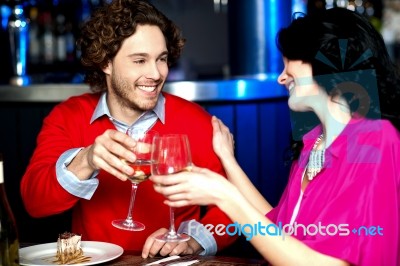 Cheers! Couple Celebrating Their Love Together Stock Photo
